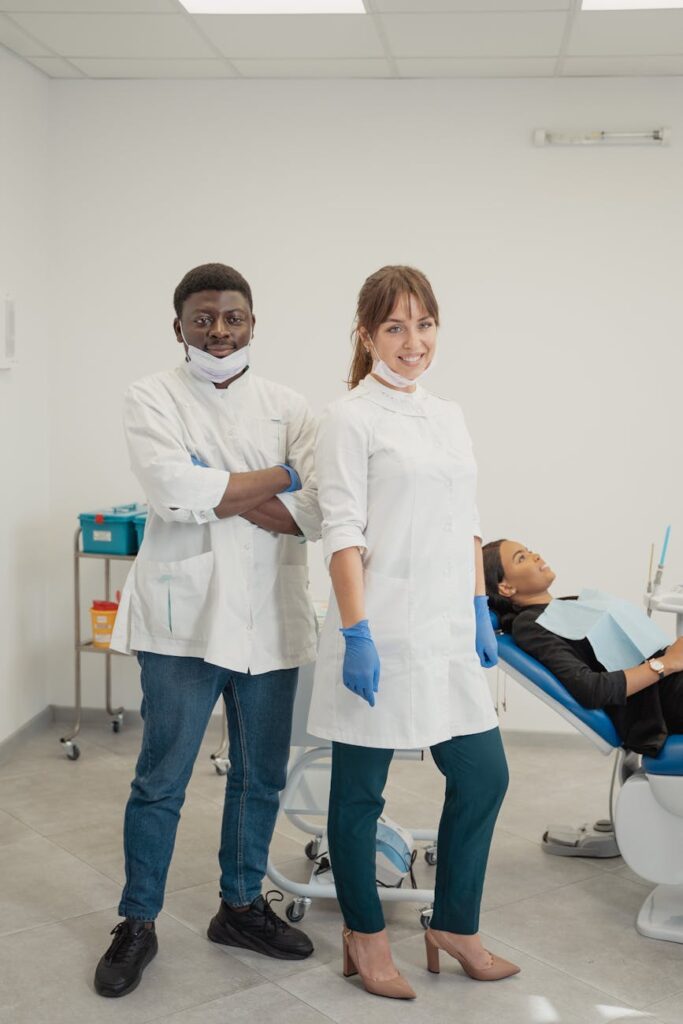 dentists and a patient in a dental room